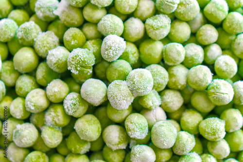 Frozen green peas texture background.