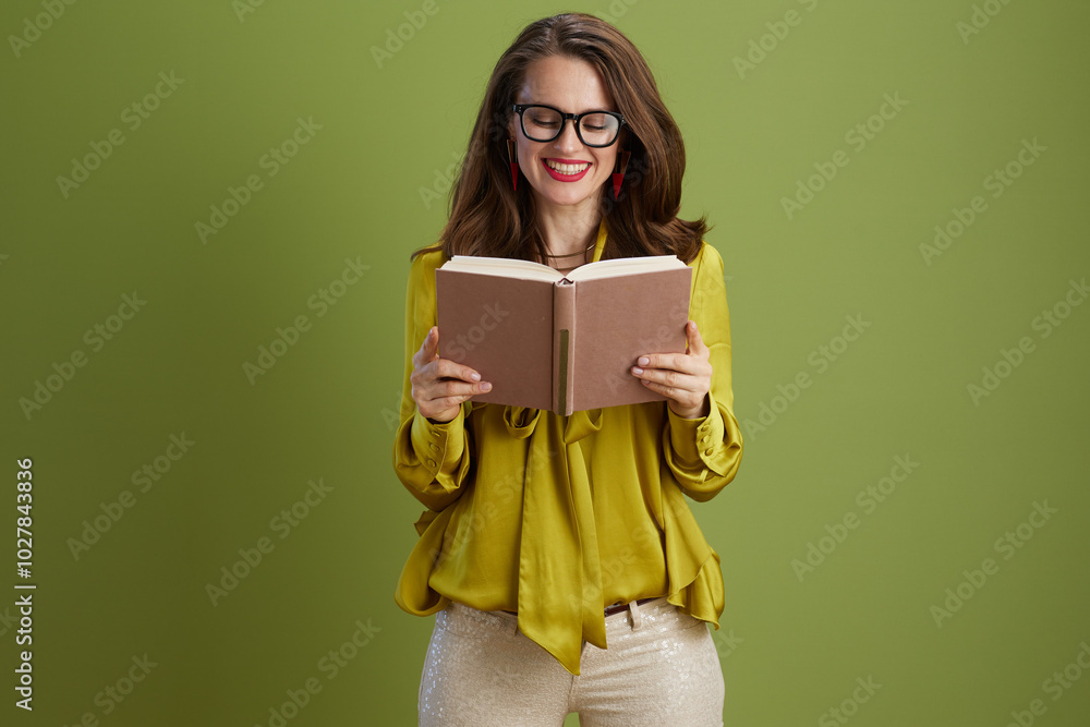 happy trendy woman in green blouse and glasses on green happy trendy woman in green blouse and glasses on green