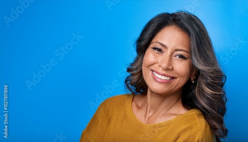 happy modern 40 years old woman on blue