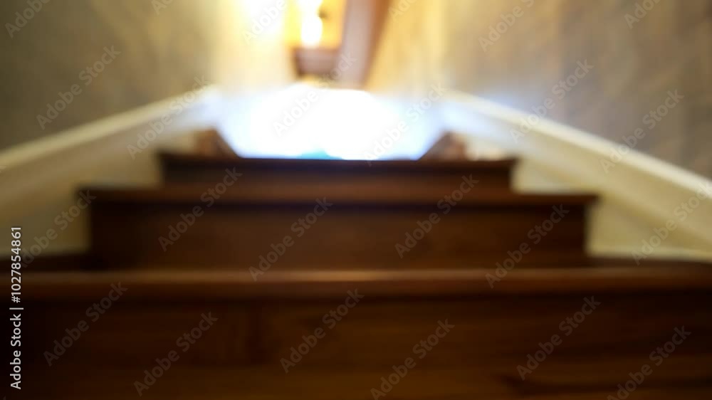 Blurry abstract of wooden staircase leading to a bright light source. Blurry abstract of wooden staircase leading to a bright light source.