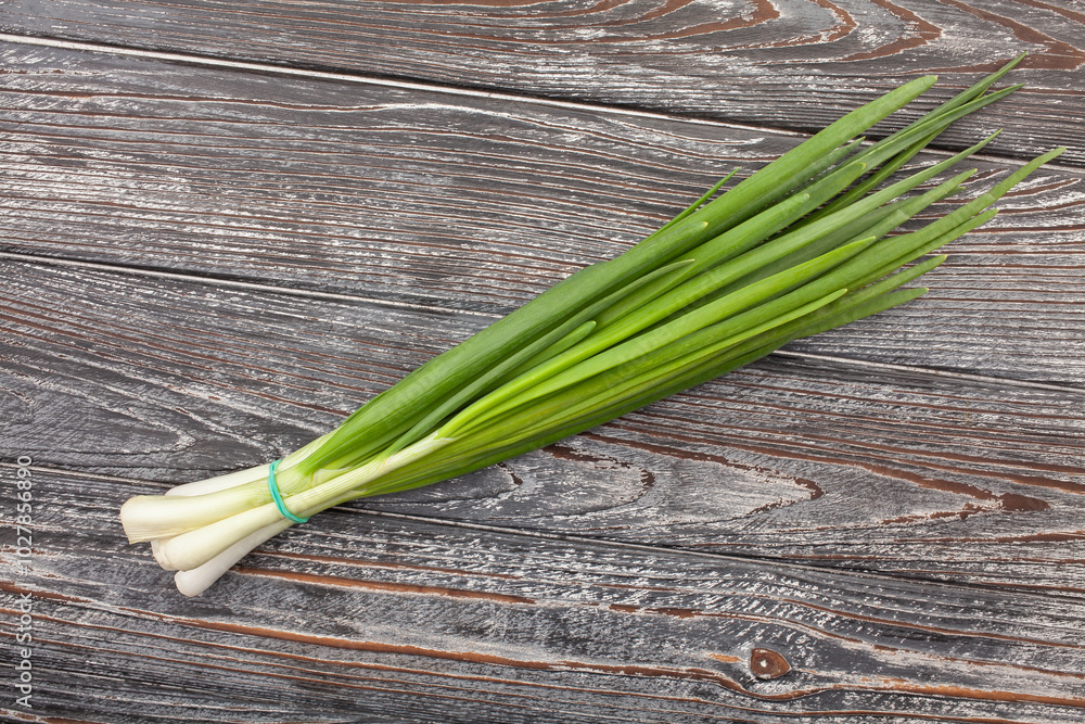 young onion scallion on wood background top view young onion scallion on wood background top view