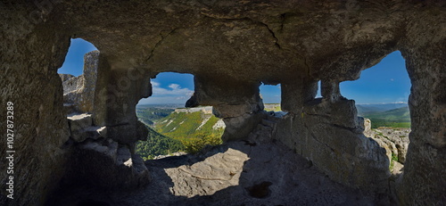 Russia, the Republic of Crimea. A view from inside the dilapidated stone room of the famous cave city of Mangup-Kale of the 5th century in the Bakhchisarai district. photo