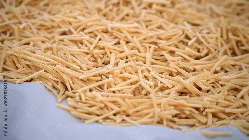 Cutting noodles from homemade natural wheat flour dough,