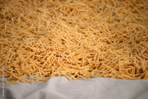 Obraz na płótnie hand cut noodles, noodles cut thinly with a knife, noodles in Turkish culture, w salonie