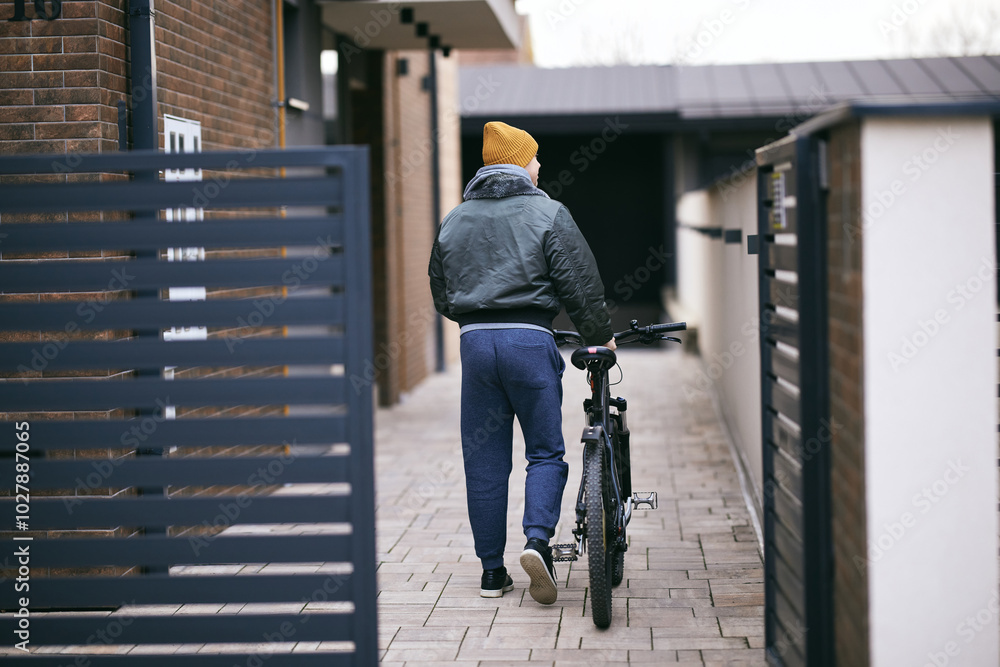 Fototapeta premium Man With Bicycle Coming Home From Bike Ride