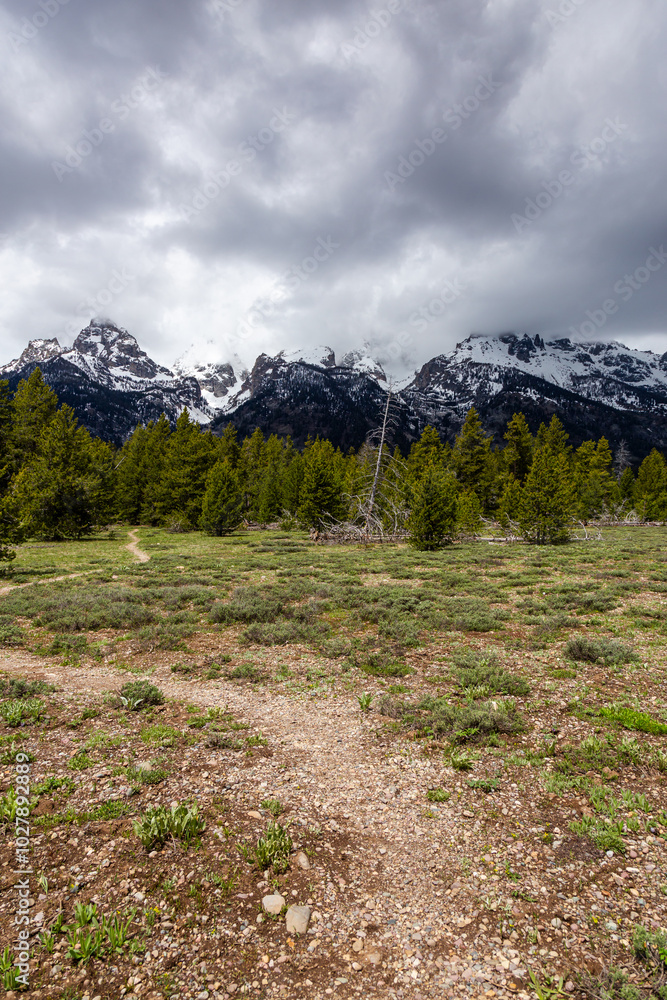 Majestic Grand Teton Mountains Under Dramatic Cloudy Skies Majestic Grand Teton Mountains Under Dramatic Cloudy Skies
