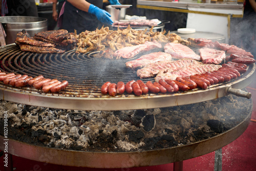Large Barbecue Grill with Assorted Meats Cooking Over Charcoal