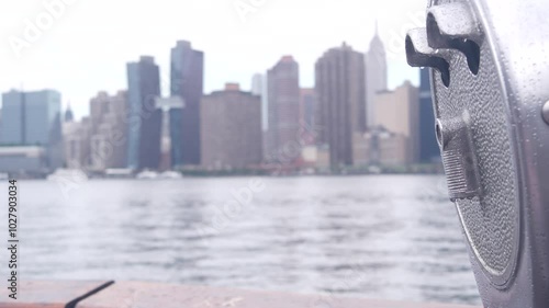 New York City waterfront skyline, Manhattan Midtown buildings, riverfront skyscrapers by East river. Waterside cityscape, tower viewer, Gantry Plaza. Long Island, Queens. United States tourism. Rainy.