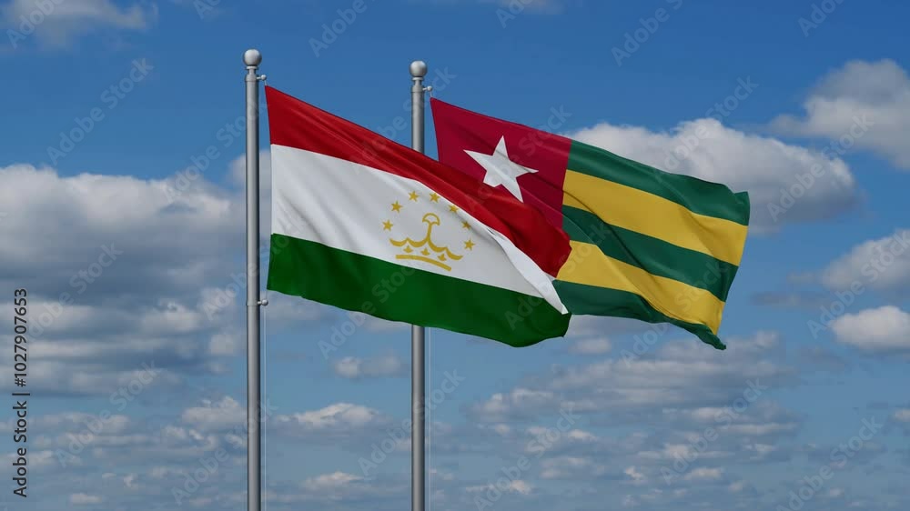 Togo, Togolese Republic and Tajikistan flags flying together, video concept of the relationship, two country cooperation concept Togo, Togolese Republic and Tajikistan flags flying together, video concept of the relationship, two country cooperation concept