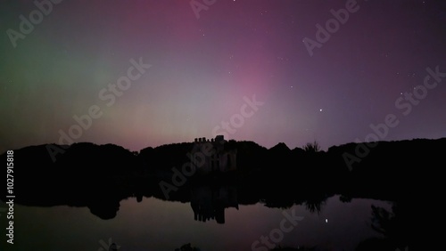 Obraz na płótnie Aurora borealis, northern lights in the sky above Menlo castle, Galway, Ireland, nature background w salonie