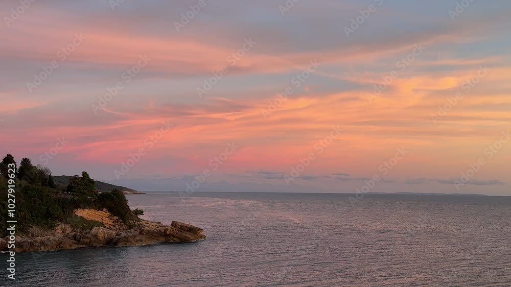 Stunning sunset over the sea and rocky coast. Stunning sunset over the sea and rocky coast.
