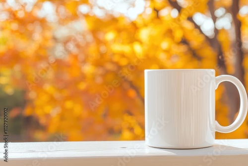 A warm cup on a wooden railing against a backdrop of vibrant autumn leaves in a serene setting