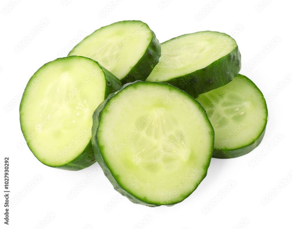 Pile of fresh cut cucumber slices isolated on white Pile of fresh cut cucumber slices isolated on white