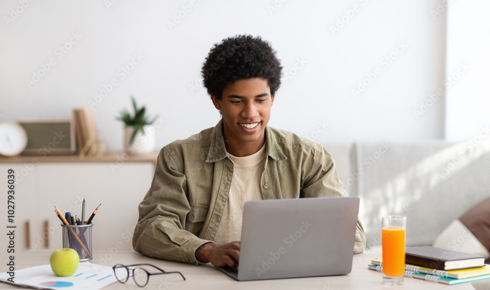 © Prostock-studio - E-learning concept. African American teenager studying online on laptop computer at home. Black youth using PC to make home assignment, talk to his college teacher or fellow students on webcam