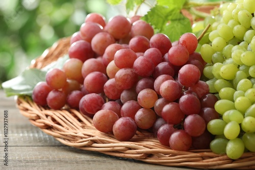 Fresh ripe grapes on wooden table, closeup