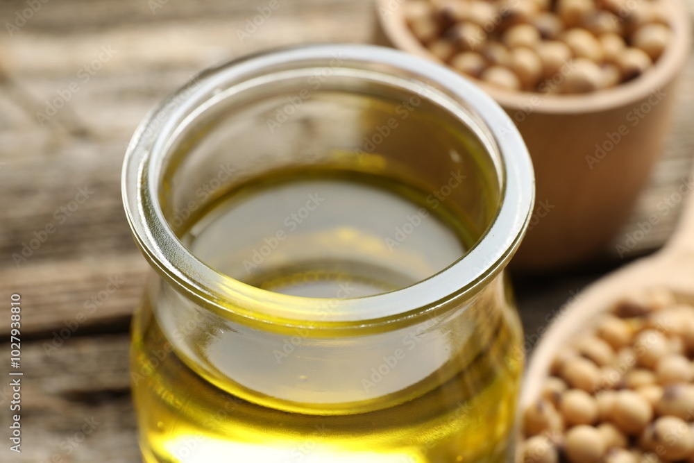 Cooking oil in jar on table, closeup Cooking oil in jar on table, closeup