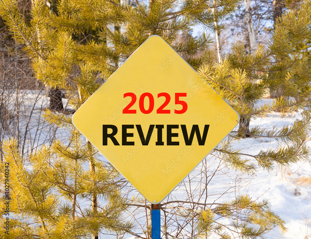 Planning 2025 review new year symbol. Concept words 2025 Review on beautiful yellow road sign