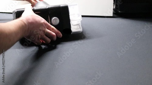 Male European with cpap machine checking therapy equipment like cpap filter or humidifier for health check and night preparation for innovative healthy sleep respiratory system with sleep apnea mask