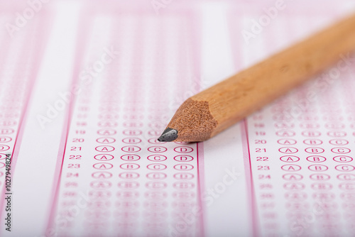 Exam, a hand taking an exam with a pen on an optical reader. Exam, an idea concept. Anxiety about the future, uncertainty. Multiple choice exam. Adults taking an exam. photo