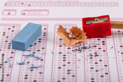 Exam, a hand taking an exam with a pen on an optical reader. Exam, an idea concept. Anxiety about the future, uncertainty. Multiple choice exam. Adults taking an exam. photo