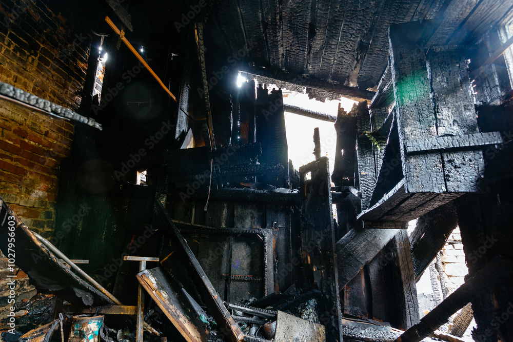 Aftermath of fire. Completely burnt house interior Aftermath of fire. Completely burnt house interior