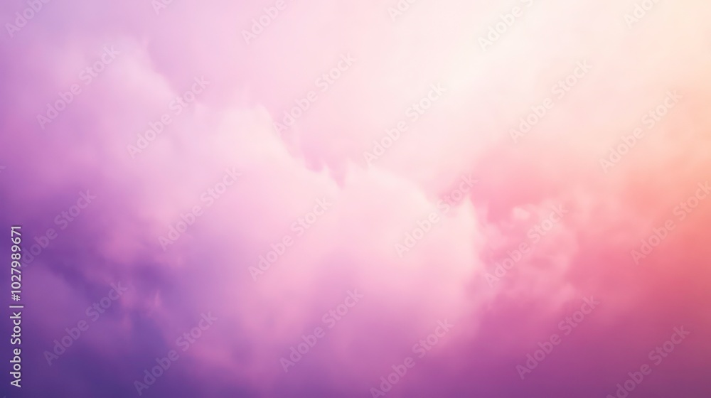 Fototapeta premium Soft, dreamy clouds in a pastel pink and purple sky.