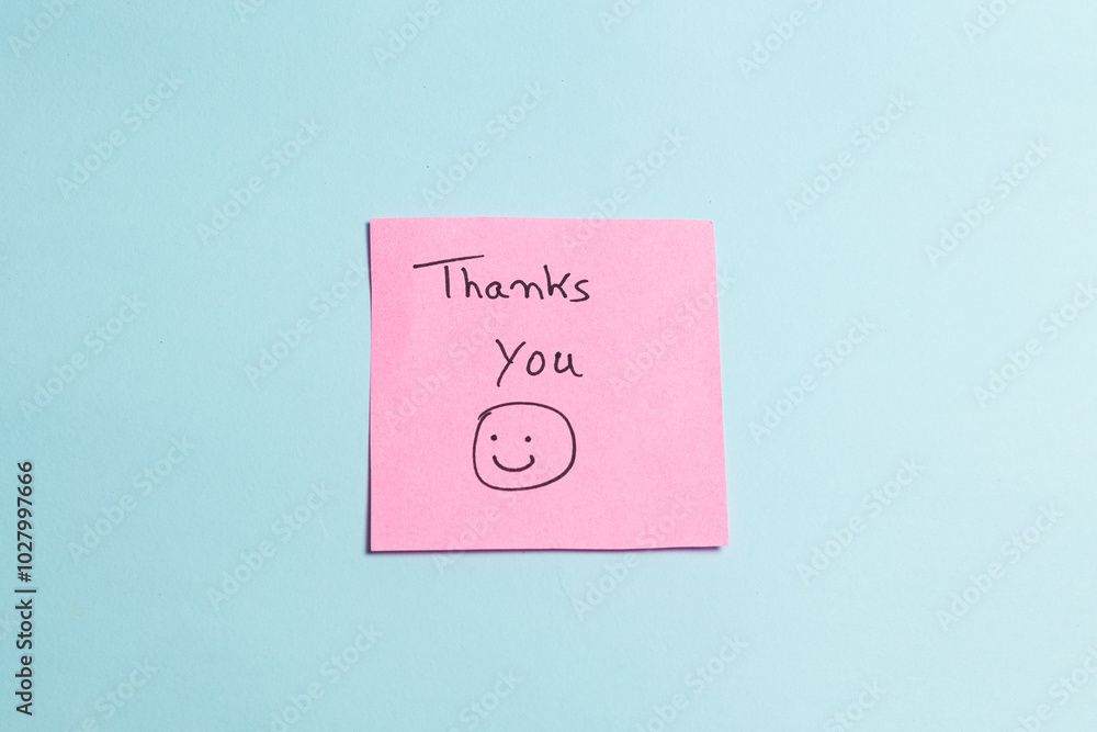 A pink sticky note with a smiley face on it that says A pink sticky note with a smiley face on it that says
