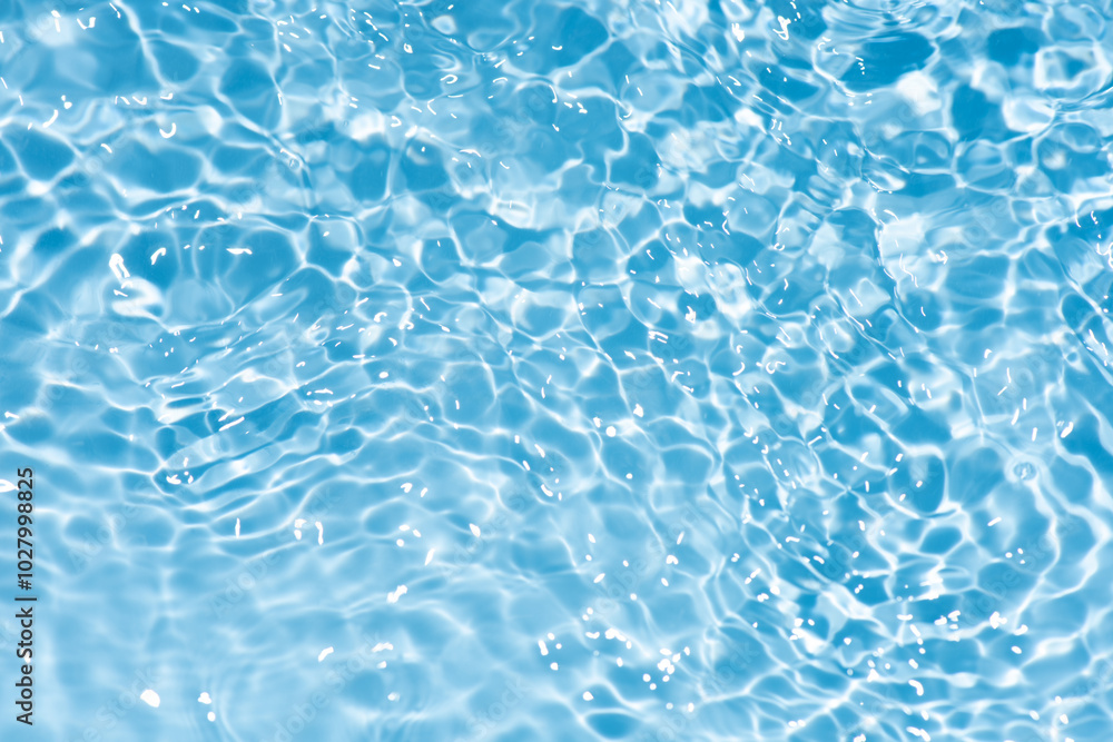 Blue water with ripples on the surface. Defocus blurred transparent blue colored clear calm water surface texture with splashes and bubbles. Water waves with shining pattern texture background. Blue water with ripples on the surface. Defocus blurred transparent blue colored clear calm water surface texture with splashes and bubbles. Water waves with shining pattern texture background.