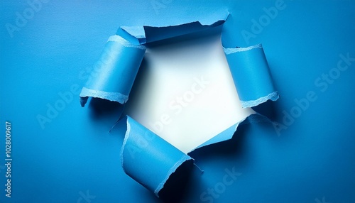 blue torn paper that curls to a white opening