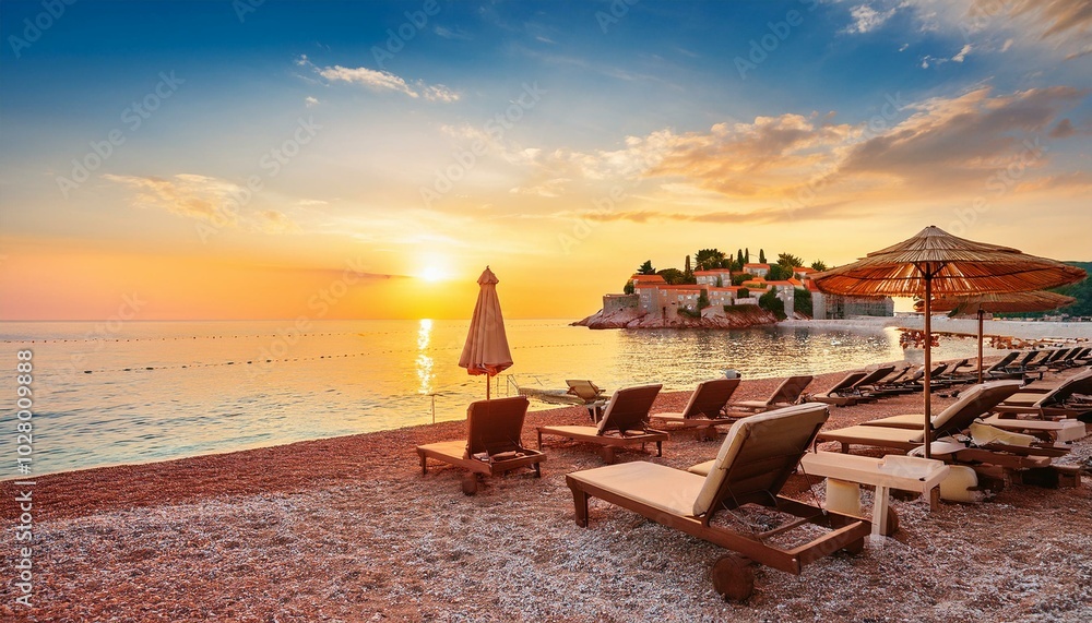 captivating sunset at beach with chaise lounges and umbrellas in sveti stefan near budva