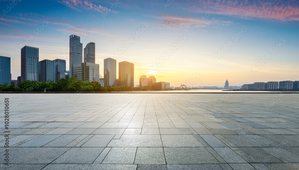 empty square floor and city skyline with modern commercial buildings in hangzhou at sunrise china