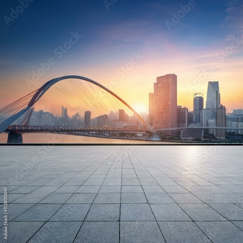 empty square floor and bridge with city skyline at sunset