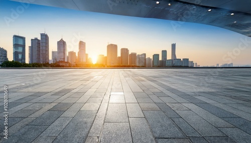 empty square floor and city skyline with modern commercial buildings in hangzhou at sunrise china