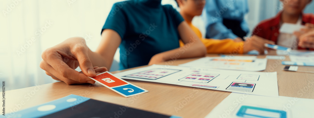 Panorama banner of startup company employee planning on user interface prototype for mobile application or website in office. UX UI designer brainstorm user friendly interface plan. Synergic Panorama banner of startup company employee planning on user interface prototype for mobile application or website in office. UX UI designer brainstorm user friendly interface plan. Synergic