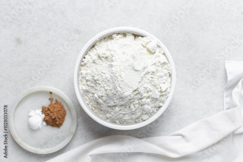All purpose flour in a ceramic bowl, baking flour in a bowl