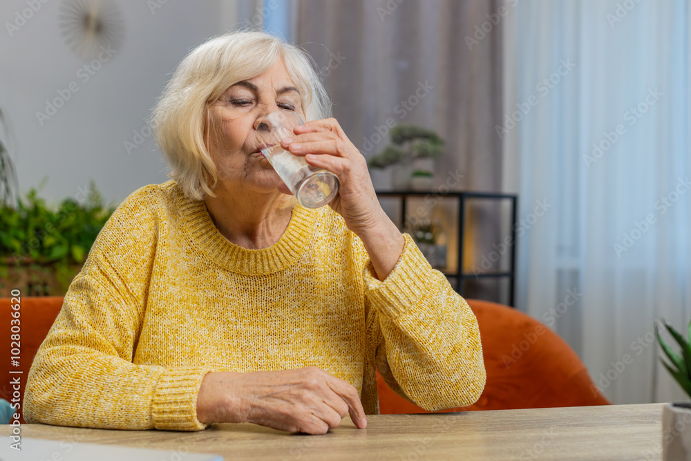 Thirsty Senior Woman Hold Glass Of Natural Filtered Aqua Make Sips