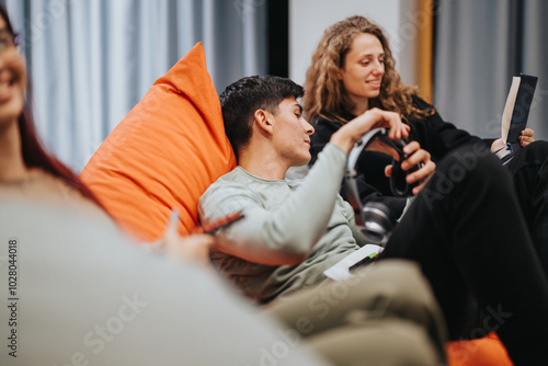 A group of high school students relax on bean bags while studying and socializing in a cozy learning environment, creating a positive and collaborative atmosphere for education.