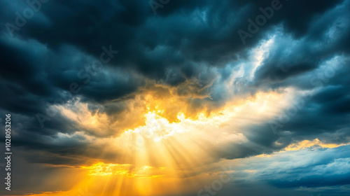 Dramatic dark clouds with sunlight breaking through, creating stunning contrast in sky. scene evokes sense of awe and wonder.