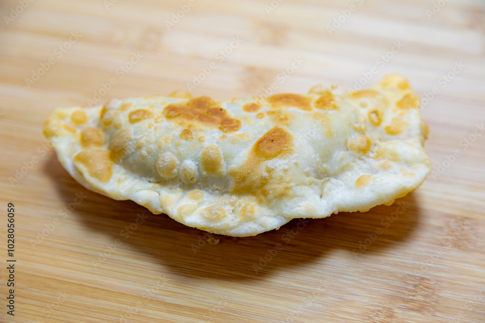Traditional rustic Brazilian pastry, fried and stuffed with ground beef