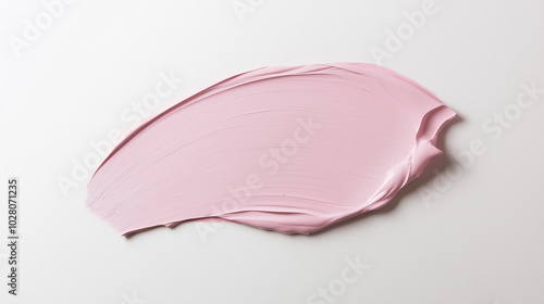 a paint swatch in a soft pink color on a pristine white background