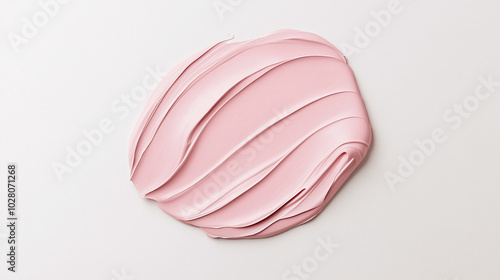 a paint swatch in a soft pink color on a pristine white background