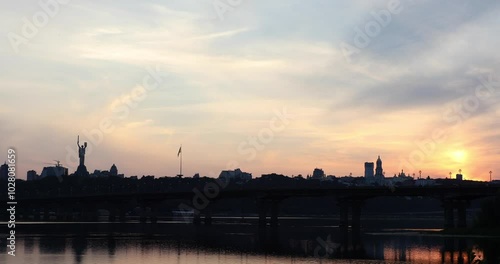 Beautiful view of the Mother Ukraine monument Paton Bridge on the Dnipro river in Kyiv, Ukraine