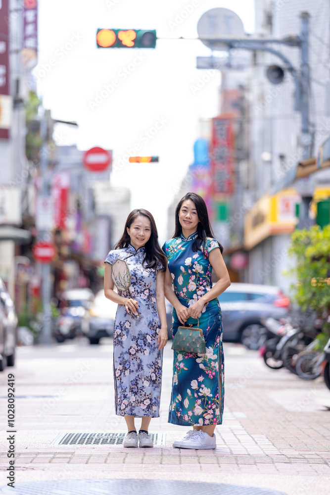 Two Taiwanese women in their 30s wearing traditional Chinese clothing are enjoying their time on Dihua Street in Taipei City, Taiwan, in September. Two Taiwanese women in their 30s wearing traditional Chinese clothing are enjoying their time on Dihua Street in Taipei City, Taiwan, in September.