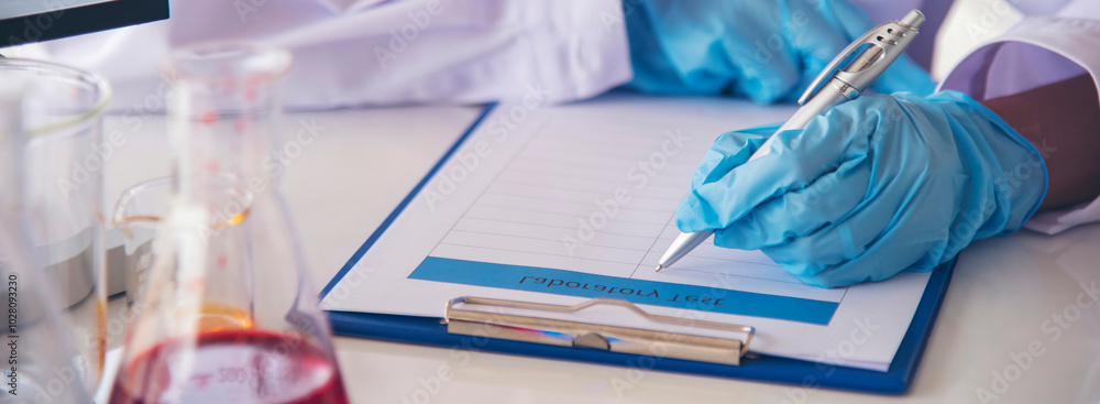 Banner Asian woman scientist hand write note research in medical lab look at science microscope. Panorama biology chemistry lab. Asian Female technician laboratory using microscope with copy space Banner Asian woman scientist hand write note research in medical lab look at science microscope. Panorama biology chemistry lab. Asian Female technician laboratory using microscope with copy space
