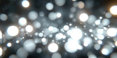 Soft silver and white bokeh lights creating a dreamy defocused background for artistic and design purposes.