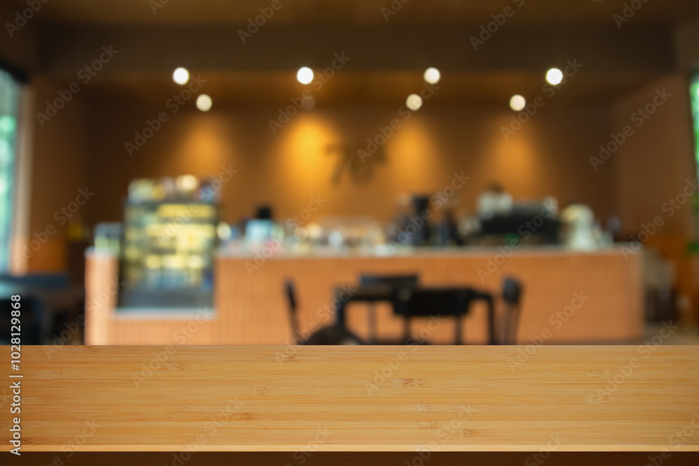 Abstract blur interior coffee shop restaurant or cafe and kitchen for background, counter top on of clean abstract home indoor. Warm tone used for display or montage your food dining banner products. Abstract blur interior coffee shop restaurant or cafe and kitchen for background, counter top on of clean abstract home indoor. Warm tone used for display or montage your food dining banner products.