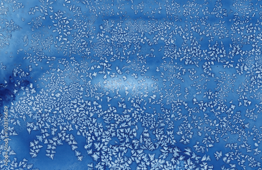Abstract blue frost pattern resembling ice crystals, perfect for winter-themed designs, backgrounds, and creative projects. Abstract blue frost pattern resembling ice crystals, perfect for winter-themed designs, backgrounds, and creative projects.