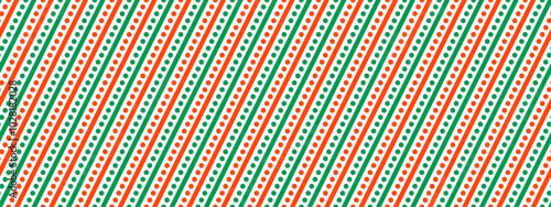 Christmas seamless pattern. Red and green diagonal straight dotted stripe background. Candy cane repeated decor wallpaper. Christmas peppermint present wrap print. Vector winter holiday gift backdrop