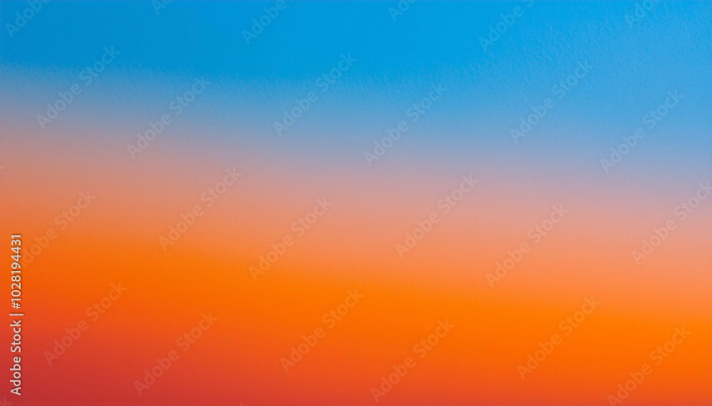 Obraz premium Fiery Sunset Hues: A breathtaking gradient of orange and blue paints the sky, a vibrant masterpiece of nature's artistry.