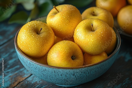 A bowl of apples with a blue rim photo